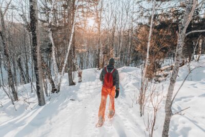 Man snowshoeing in the woods