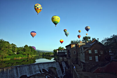Hot air balloons over the Ottauquechee River in Quechee Vermont