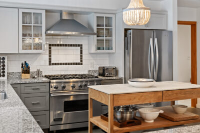 Custom chef’s kitchen with Viking appliances, granite counters, and center island