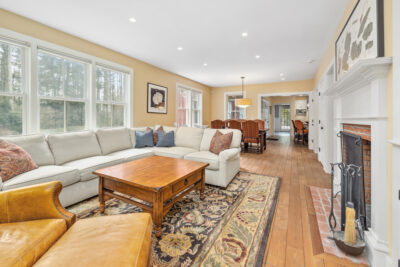 Spacious living room with wood burning fireplace