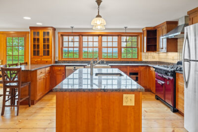 Bright, open kitchen designed to capture natural light and mountain views.